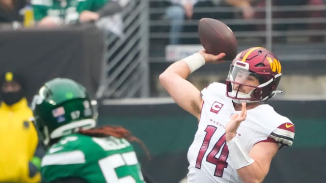 Dec 24, 2023; East Rutherford, New Jersey, USA; Washington Commanders quarterback Sam Howell (14) throws against the New York Jets in the first quarter at MetLife Stadium.